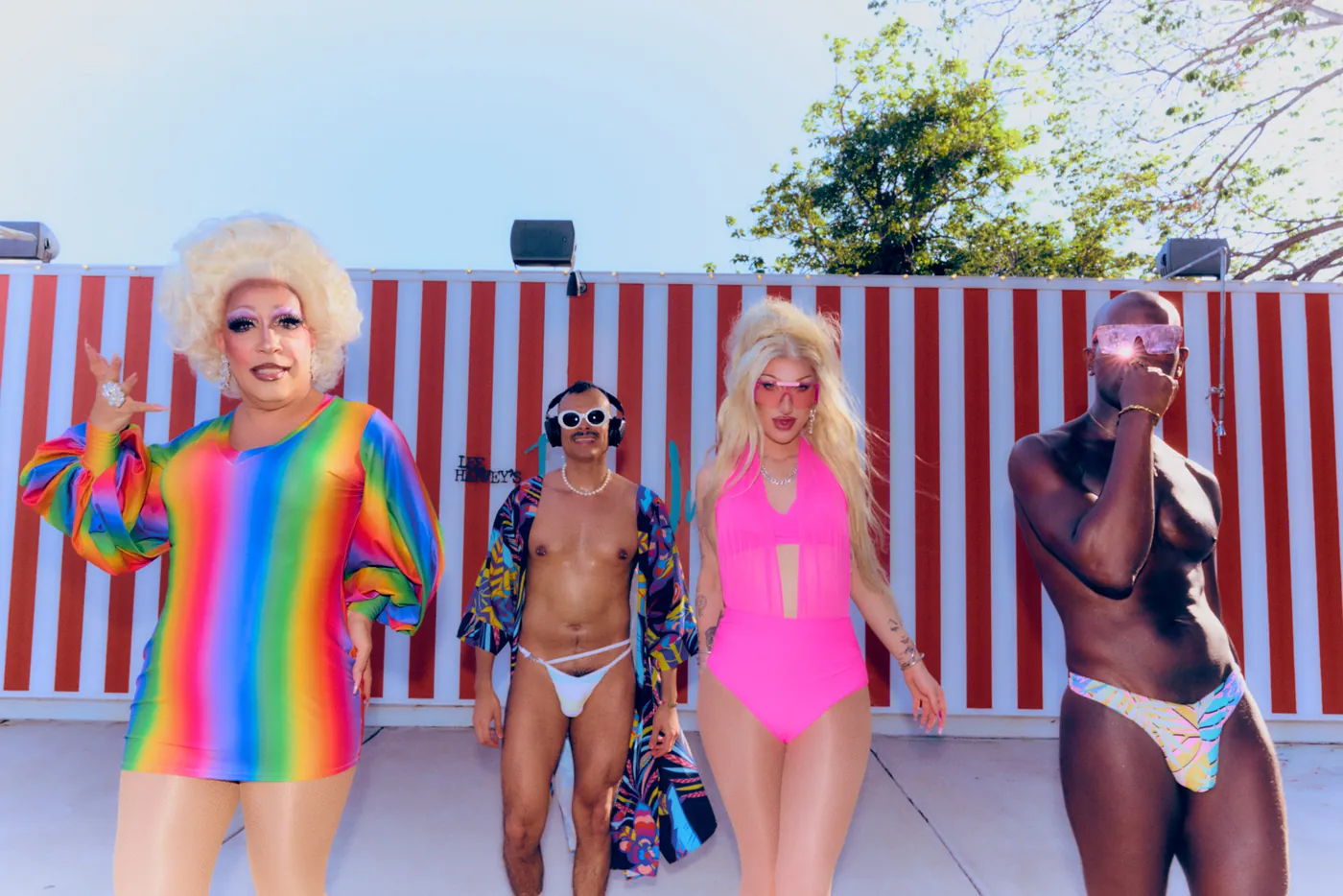 A drag performer in stripes at Summer House
